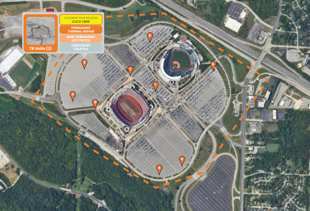 Aerial view of a large entertainment venue parking lot with marked locations for pothole repair services, showcasing asphalt maintenance solutions and ADA compliance.